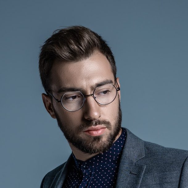 young-handsome-businessman-in-formal-suit-and-glasses-e1618243153342.jpg